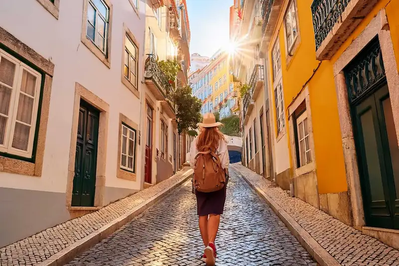 Tourist exploring a typical Lisbon street